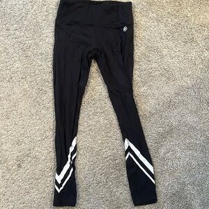 Tory Burch Sport black athletic leggings with white design at bottom